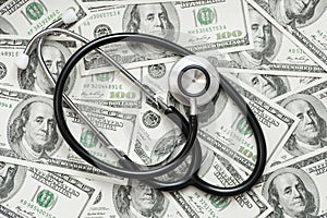 Stethoscope on the dollars. Medical costs. Healthcare payment concept. Concept of analysis of the market and economy and interest