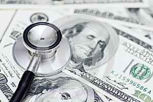 Stethoscope on the dollars. Medical costs. Healthcare payment concept. Concept of analysis of the market and economy and interest