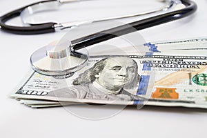 Stethoscope on the dollars. Medical costs. Healthcare payment concept