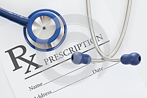 Stethoscope with drug prescription on table