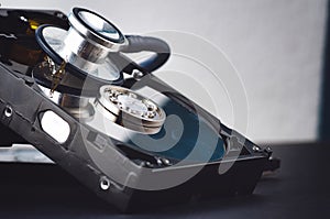 stethoscope dusty dismantle hard disk over dark background