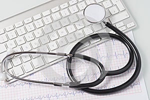 Stethoscope, ecg and keyboard on doctor's desk