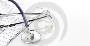 Stethoscope on EKG graph background. Medicine concept. Copy space