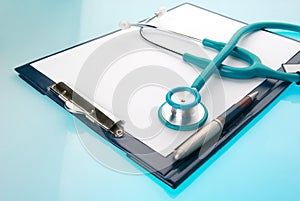 Stethoscope and empty document in a clipboard