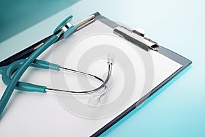 Stethoscope and empty document in a clipboard