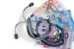 stethoscope and euro banknotes, symbolic photo for cost of healtcare