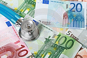 Stethoscope and euro money.