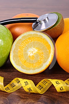 Stethoscope, fresh fruits and centimeter, healthy lifestyles and nutrition concept