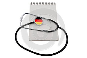 Stethoscope with a German flag head and a blank notepad