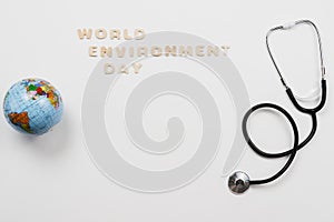 stethoscope globe with word environment day text. High quality photo
