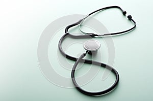 Stethoscope on a green background