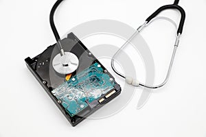 Stethoscope with hard disk isolated and white background this image for technology security checkup concept