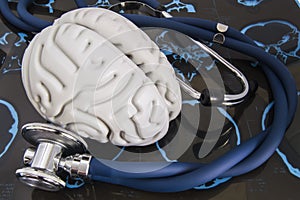 Stethoscope and human brain lied on recorded x-ray film surveys of computed tomography SCT or magnetic resonance imaging MRI.