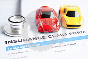 Stethoscope on Insurance claim accident car form, Car loan, insurance and leasing time concepts