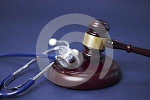 Stethoscope and judgement hammer. Gavel and stethoscope. medical jurisprudence. legal definition of medical malpractice