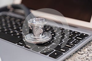 Stethoscope on keyboard countertop ready for use and data entry