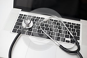 Stethoscope Laid on a Laptop Computer