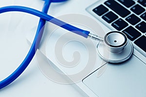 Stethoscope on laptop - Computer repair and maintenance concept.