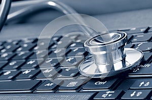 Stethoscope on the laptop keyboard