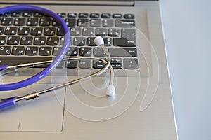 Stethoscope on laptop keyboard. Health care or IT security concept. Laptop repair concept. Computer repair concept Close