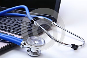 Stethoscope on laptop keyboard,stethoscope on the keyboard of pc,Medical Stethoscope Resting on Desk,relax time doctor