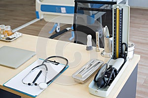 Stethoscope and laptop and other medical object on table of doctor