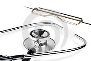 Stethoscope laying on patient information blank