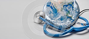 Stethoscope listening planet Earth. Global Healthcare. Stethoscope wrapped around globe on white background. Global health and