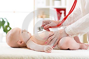 Stethoscope listening to baby`s heart beat