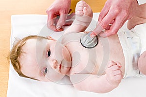 Stethoscope listening to a baby's heart beat