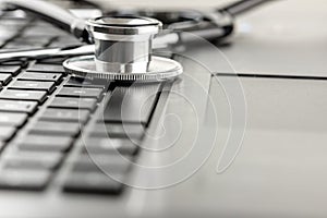 Stethoscope lying on a laptop keyboard