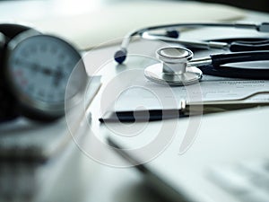 Stethoscope lying at therapeutist working table in clinic