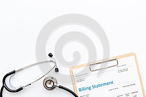 Stethoscope with medical billing statement. Top view