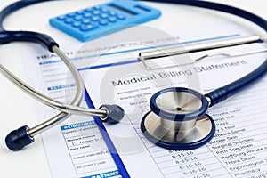 Stethoscope on medical bills and insurance