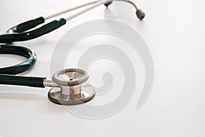 Stethoscope on medical desk with selective focus.