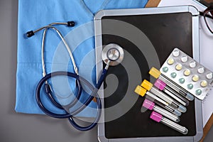 Stethoscope and Medical instruments for doctor on blue table
