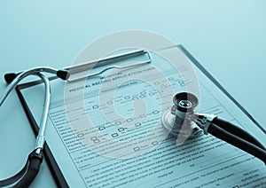 stethoscope on medical record application form