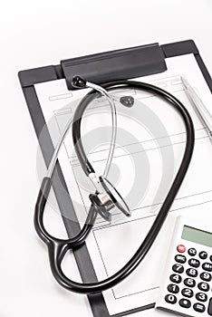 Stethoscope and medical records and Calculator.