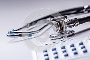 Stethoscope. Medical tool stethoscop with pills and red heart