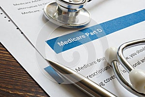 Stethoscope with medicare part D drug coverage info and pen. photo