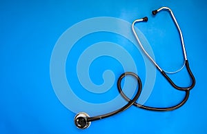 Stethoscope and medicine on blue background, Medical and Healthcare concept