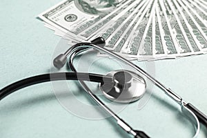 Stethoscope and money, concept. Paid medicine. Costs for the medical insurance