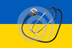 Stethoscope on the national flag of Ukraine blue and yellow