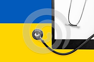 Stethoscope on the national flag of Ukraine blue and yellow