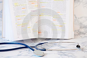 Stethoscope and book