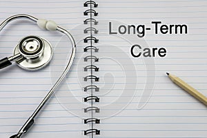 Stethoscope on notebook and pencil with Long Term Care