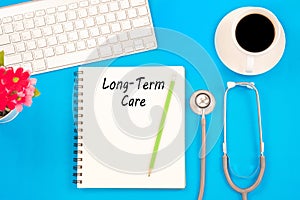 Stethoscope on notebook and pencil with Long Term Care words as