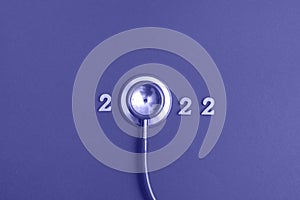 Stethoscope number 2022 on very peri background creative idea new trend medical banner calendar cover closeup with copy