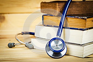 Stethoscope and old books.