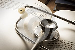 Stethoscope on open book.